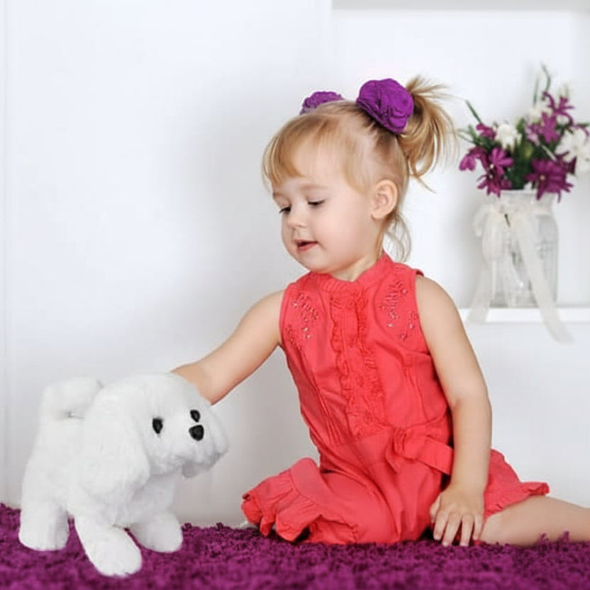 Child playing with a movable plush dog, an interactive toy for imaginative adventures. Soft stuffed animal gift.