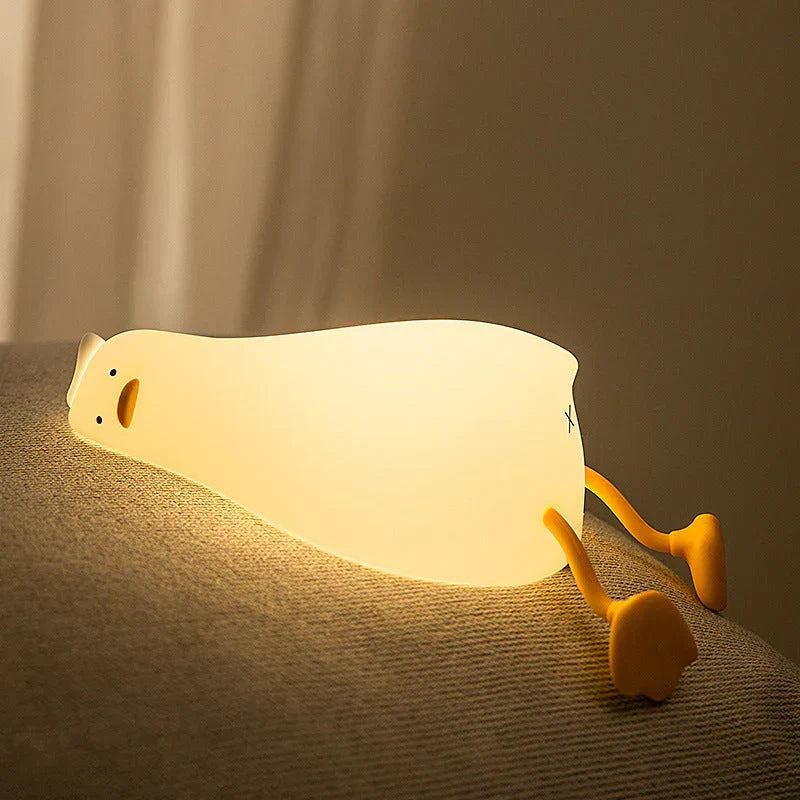 Charming duck night light for children, a soft LED silicone lamp providing a sleep aid and comforting glow.