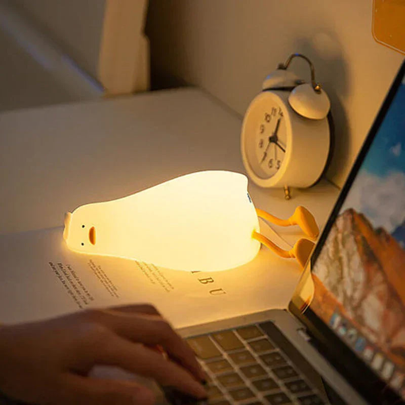 Children's adorable duck night light, LED silicone, perfect for nursery, gentle glow for peaceful sleep.