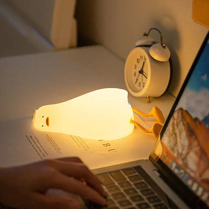 Children's adorable duck night light, LED silicone, perfect for nursery, gentle glow for peaceful sleep.