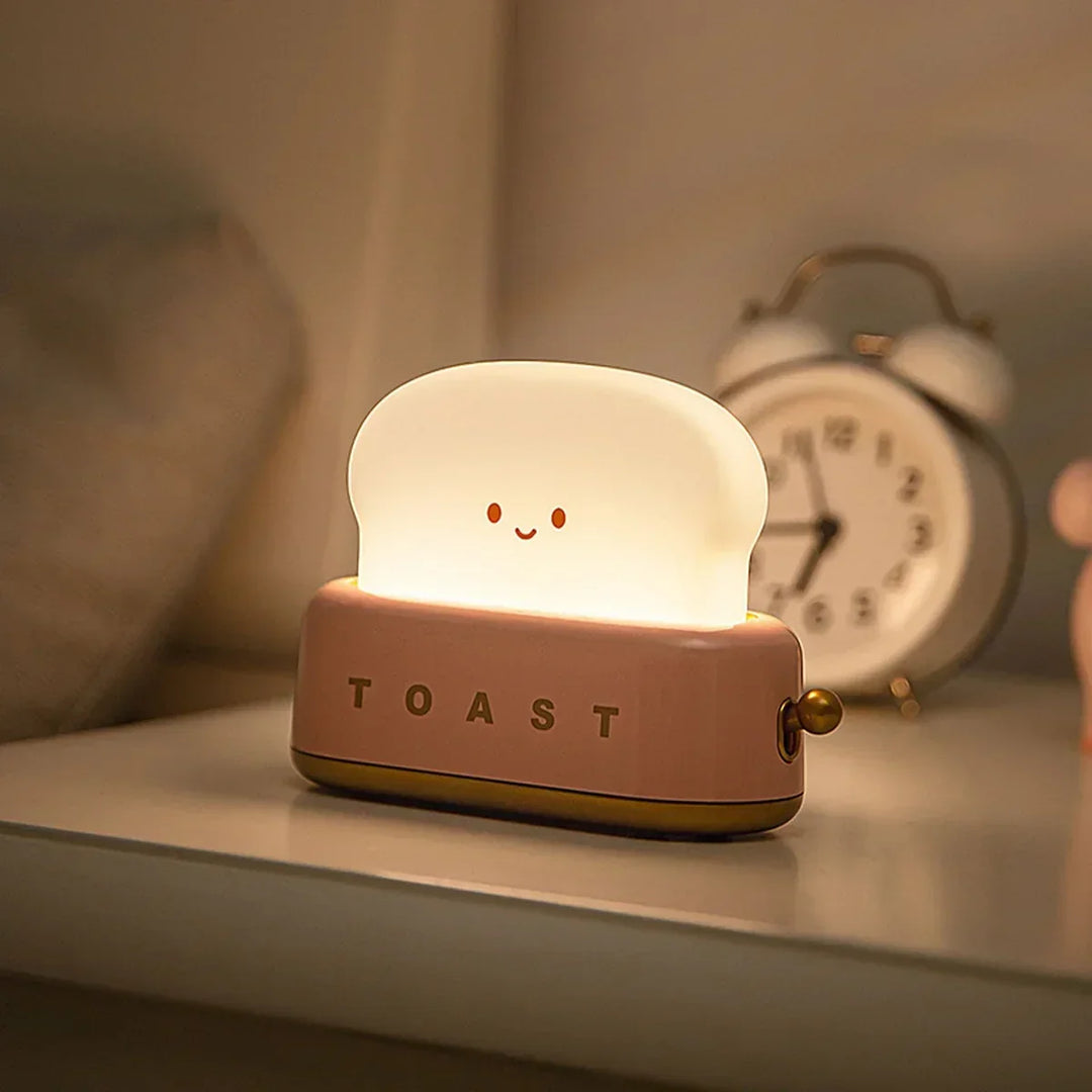Cute toast night light with dimmable LED, perfect for kids' bedside. ToastieGlow rechargeable warm light.