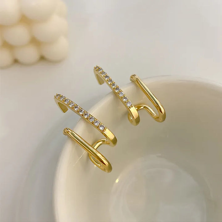 Hypoallergenic crystal stud earrings for women, featuring a dainty claw setting and brilliant sparkle. Silver-toned.
