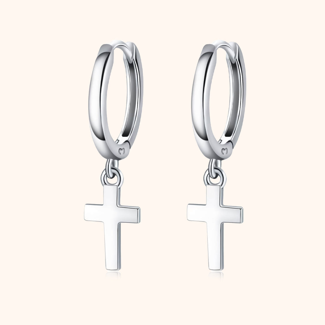 Gold plated sterling silver cross pendant hoop earrings for women. Dainty, religious, and fashionable jewelry.