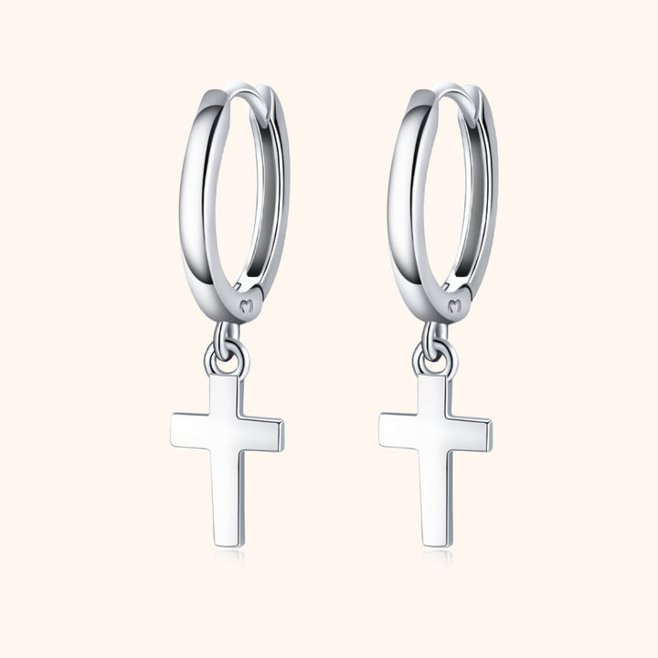 Gold plated sterling silver cross pendant hoop earrings for women. Dainty, religious, and fashionable jewelry.