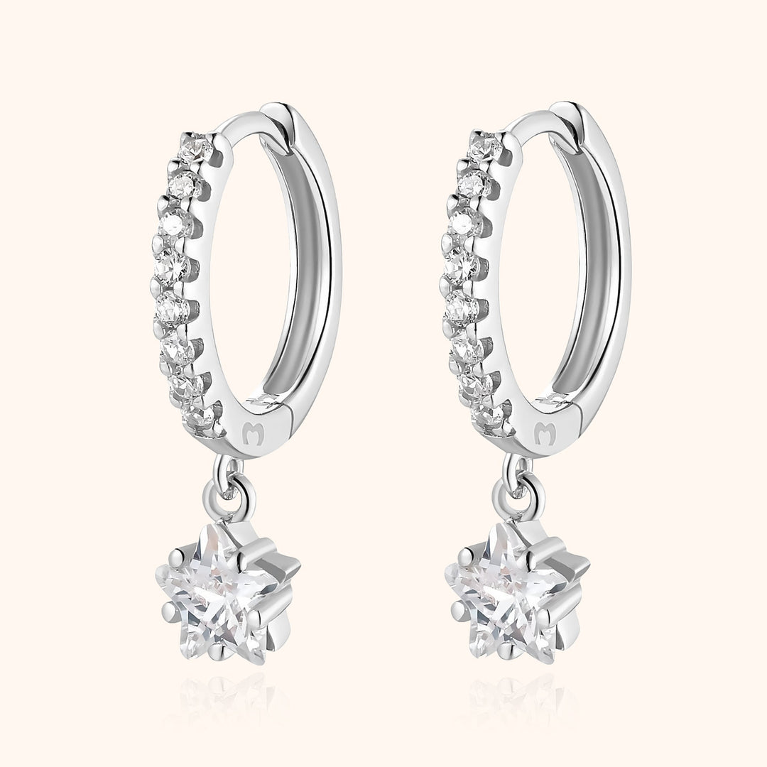 Delicate women's sterling silver star hoop earrings, dangle style, embodying celestial elegance.