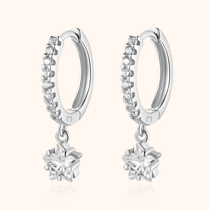 Delicate women's sterling silver star hoop earrings, dangle style, embodying celestial elegance.