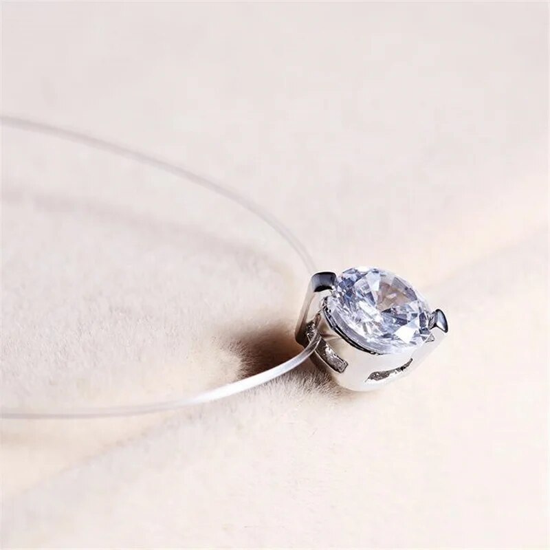 Dainty invisible fishline necklace with a sparkling round zircon, creating a floating gemstone illusion for women.
