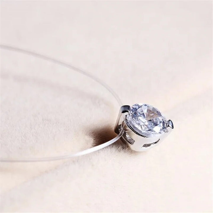 Dainty invisible fishline necklace with a sparkling round zircon, creating a floating gemstone illusion for women.
