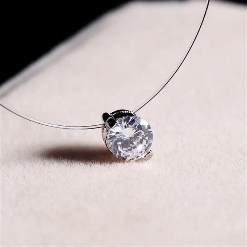 Elegant invisible necklace featuring a delicate zircon, perfect for a subtle sparkle & minimalist jewelry style.