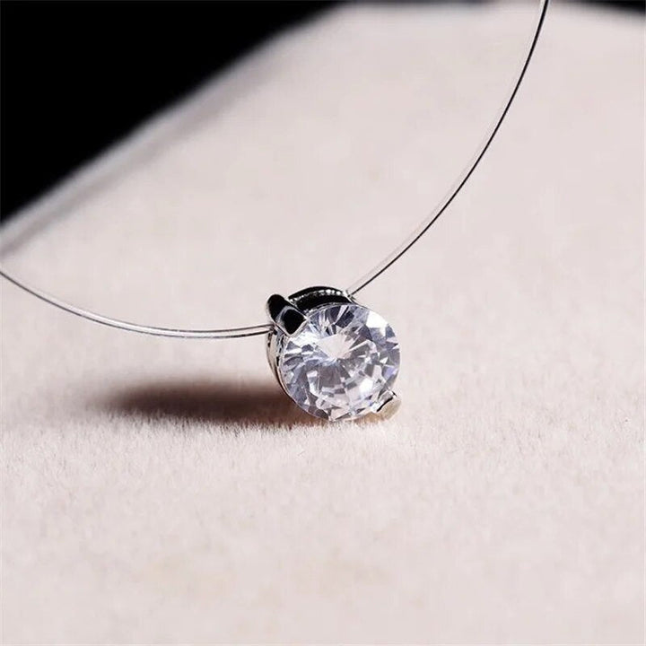 Elegant invisible necklace featuring a delicate zircon, perfect for a subtle sparkle & minimalist jewelry style.