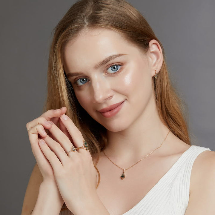 Natural moss agate ring with delicate white zircon detailing, elegant women's jewelry.
