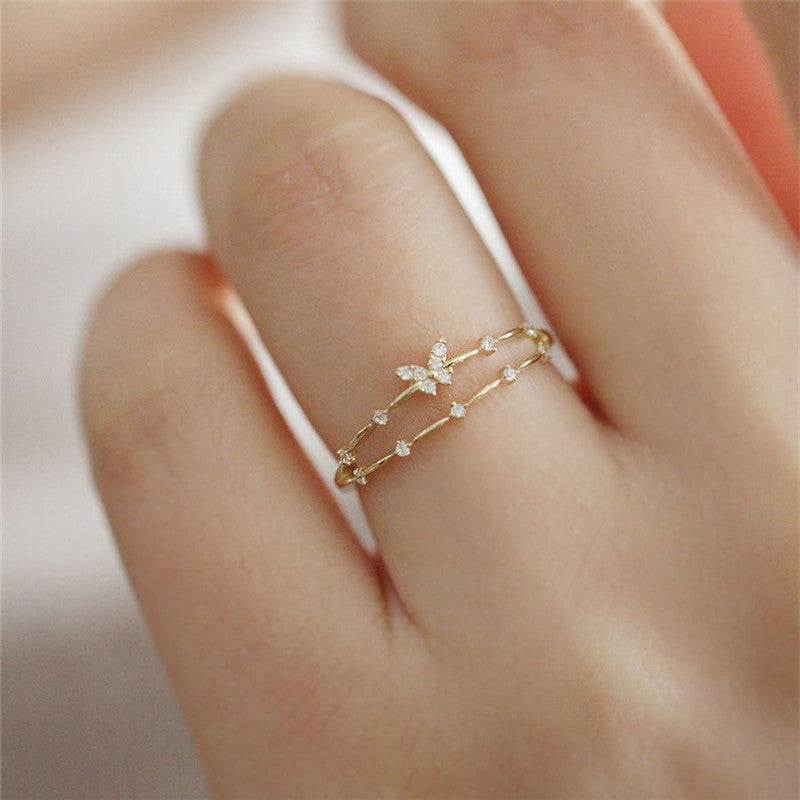 Dainty S925 silver butterfly ring for women, sparkling with clear zirconia stones, elegant design.