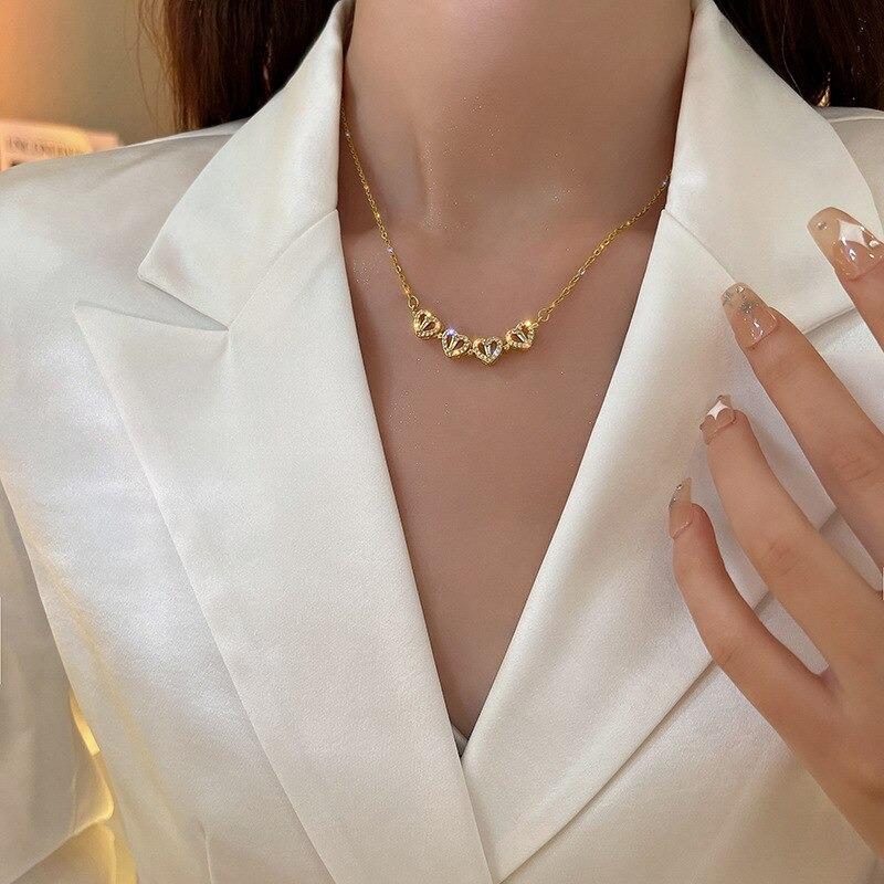 Dainty sterling silver four-leaf clover necklace for women, an elegant good luck charm and fashion accessory.