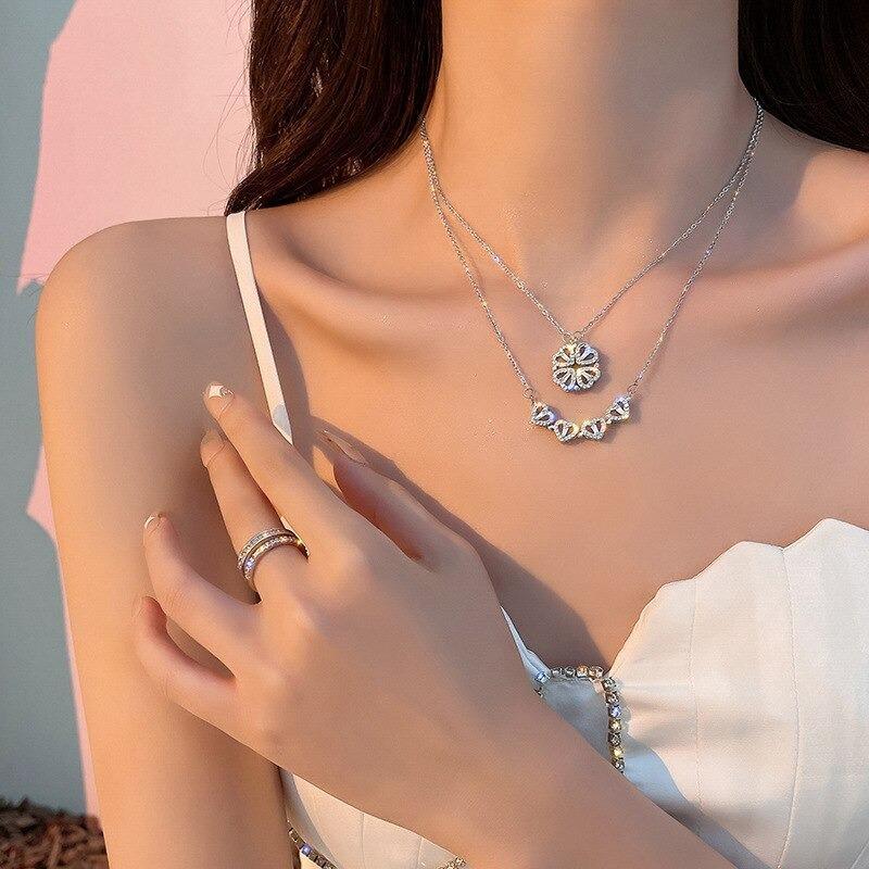 Elegant sterling silver four-leaf clover pendant on a delicate chain, a symbolic and lucky women's necklace.