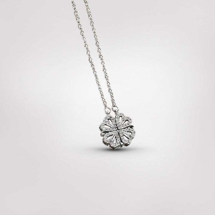 Stylish sterling silver four-leaf clover necklace for women, an elegant and dainty good luck charm accessory.