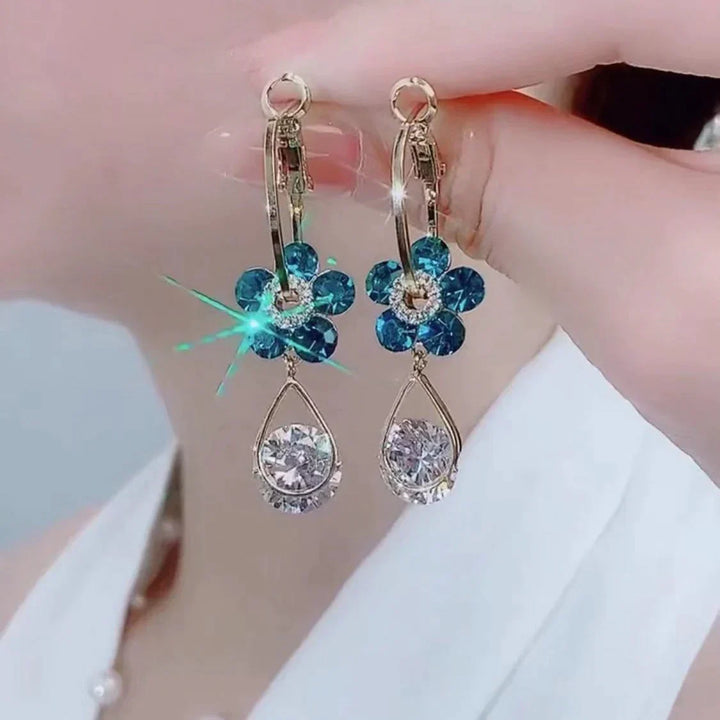 Sparkling crystal flower stud earrings for women, dainty and elegant. Versatile fashion jewelry for any look.