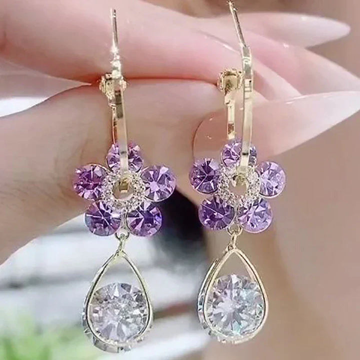 Women's dainty crystal flower stud earrings, elegant and sparkling. A beautiful addition to any jewelry collection.