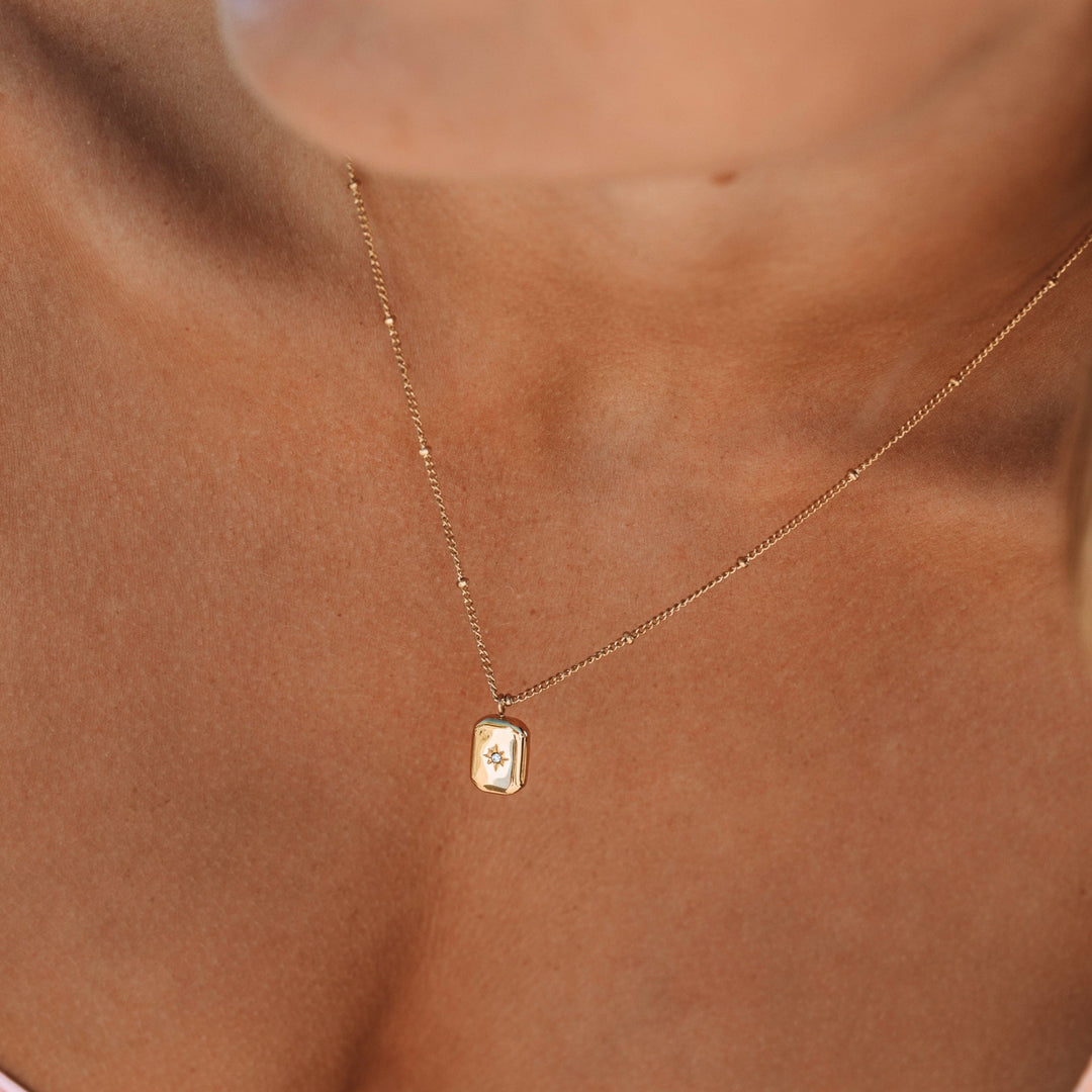 Dainty women's necklace with sparkling zirconia stone pendant, perfect elegant accessory for her.