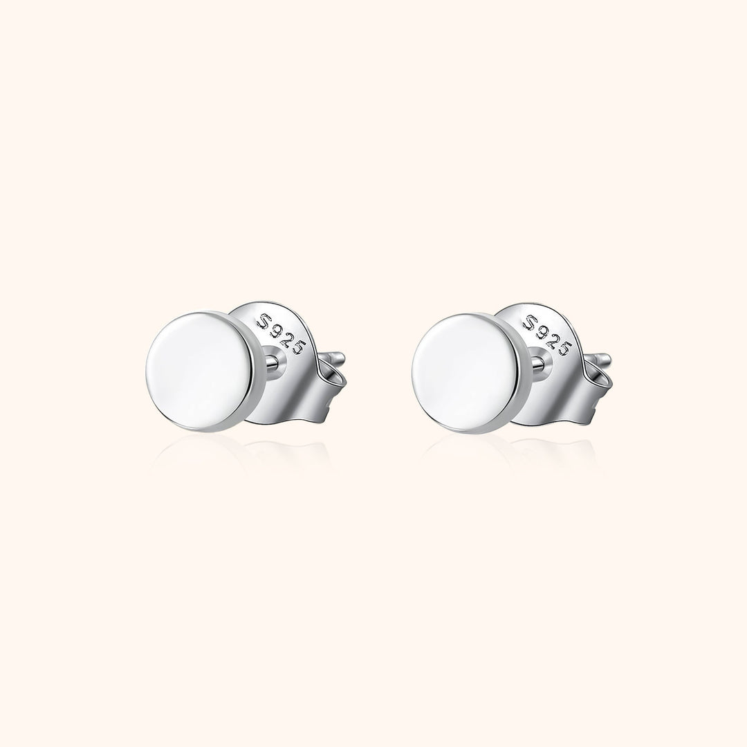 Dainty women's small ball stud earrings in sterling silver, perfect for minimalist everyday wear. Versatile and chic.