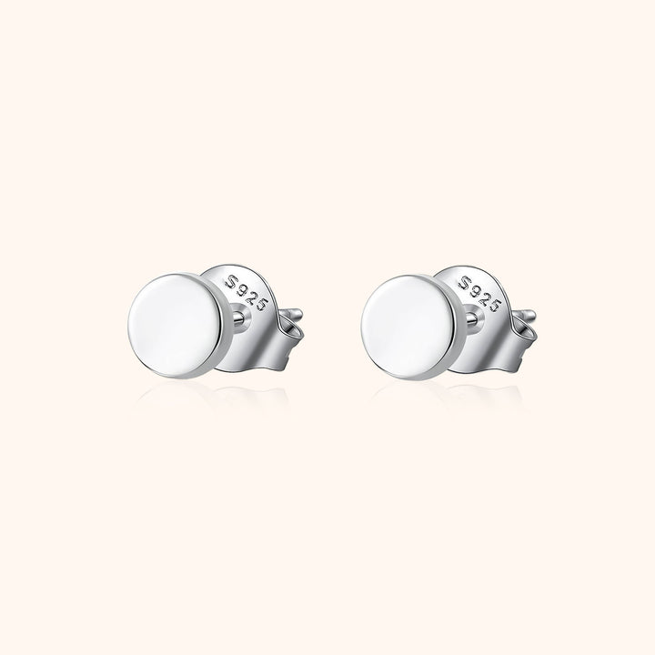 Dainty women's small ball stud earrings in sterling silver, perfect for minimalist everyday wear. Versatile and chic.