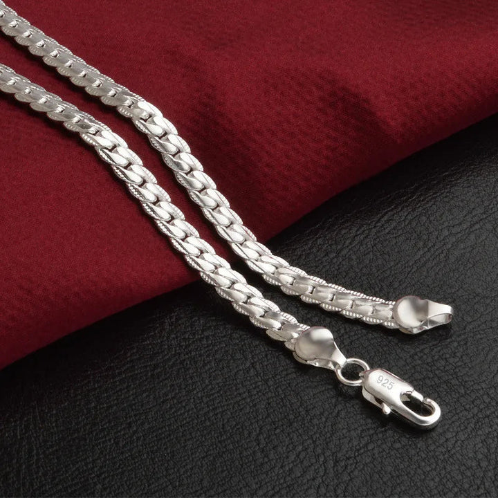Shimmering sterling silver chain necklace for women. Dainty, sparkling, elegant jewelry accessory.