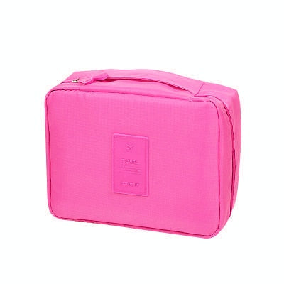 Waterproof makeup travel bag, dark blue floral design, compact and functional.