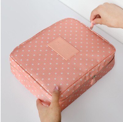 Portable beauty storage: dark blue floral waterproof makeup organizer bag.