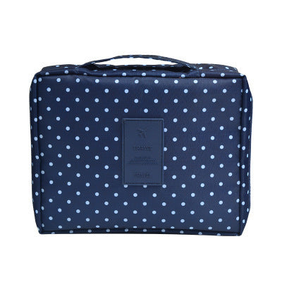 Portable waterproof makeup travel bag with elegant dark blue floral pattern.