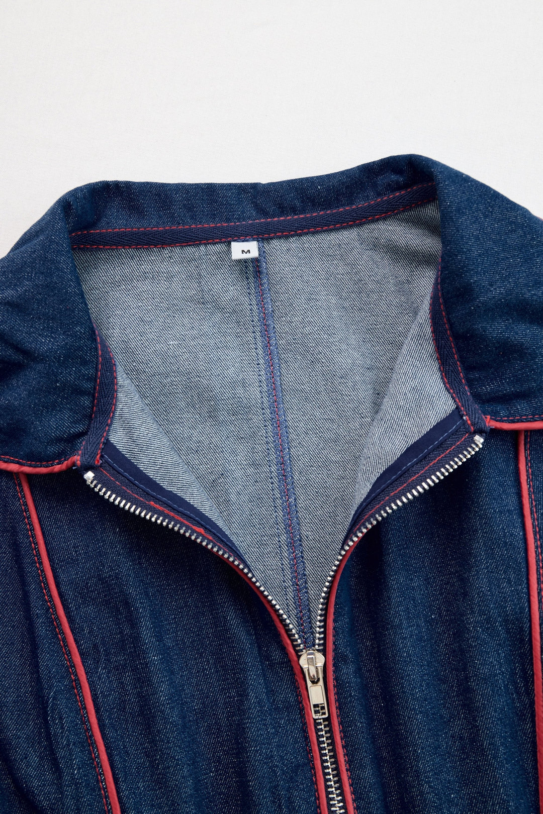 Stylish dark blue wide leg women's jumpsuit, highlighted by a practical and trendy zip front.