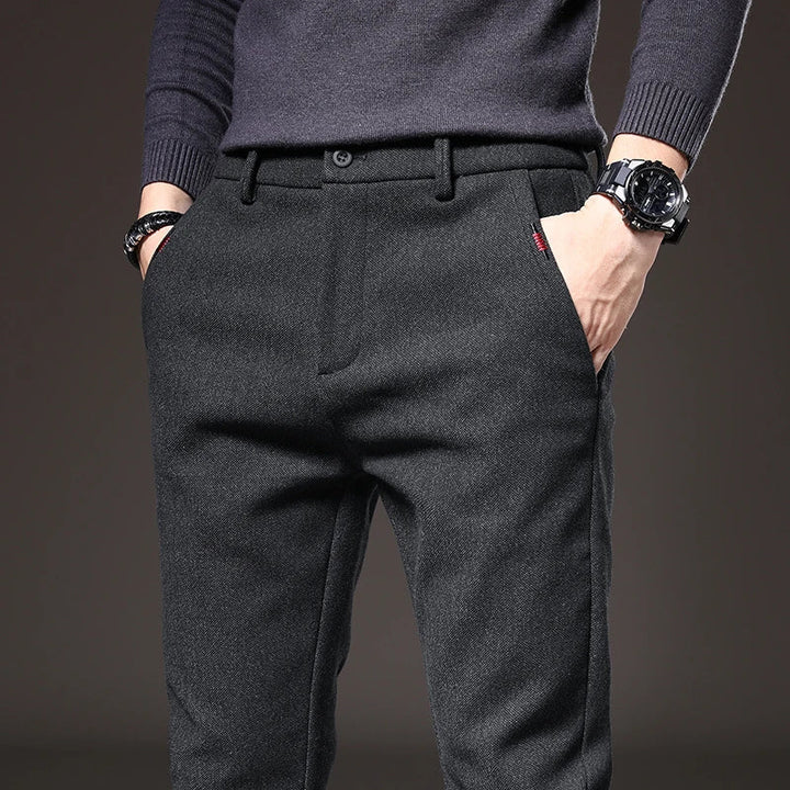 Dark gray men's slim fit stretch trousers, versatile for casual & work wear.