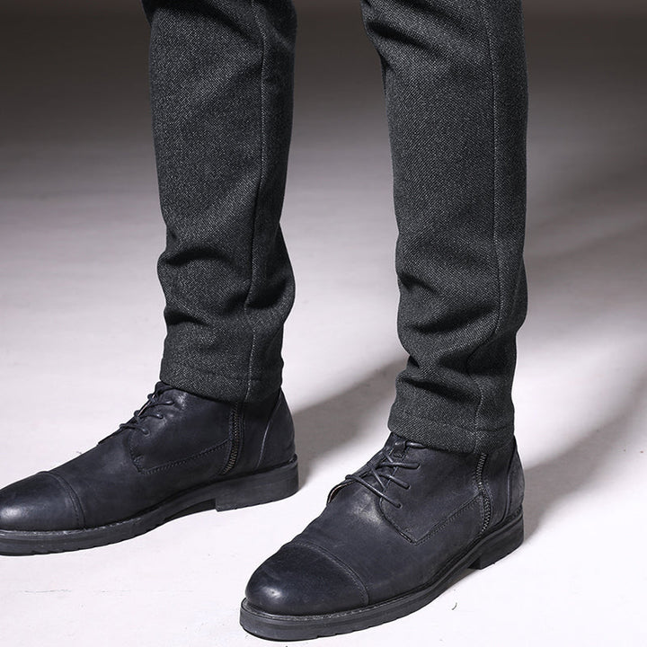 Men's dark gray slim fit trousers paired with a shirt, demonstrating versatile work-to-casual style.