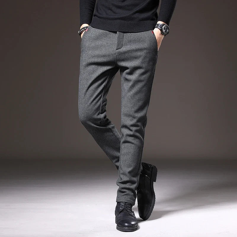 Back view of men's blue slim fit stretch trousers, showcasing modern style & comfort.