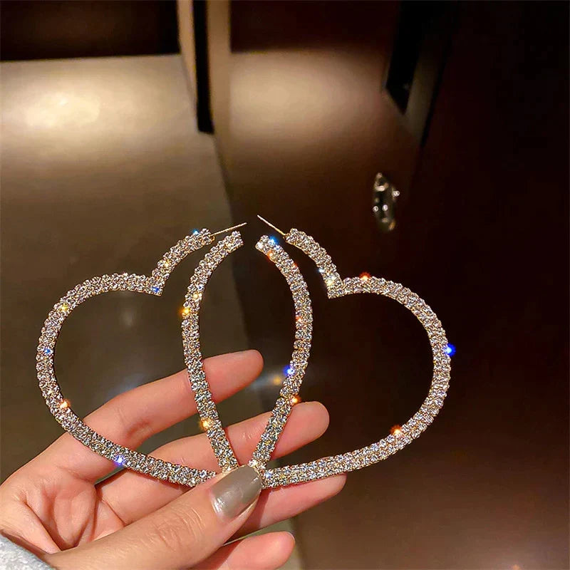 Elegant crystal heart statement earrings with shimmering facets. Beautiful jewelry for special occasions.
