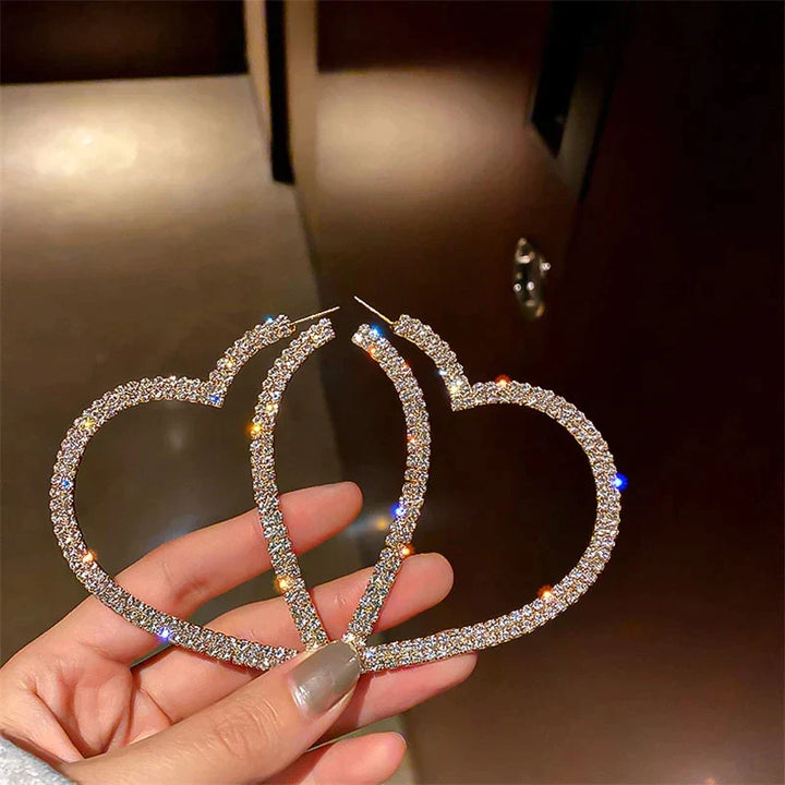 Elegant crystal heart statement earrings with shimmering facets. Beautiful jewelry for special occasions.