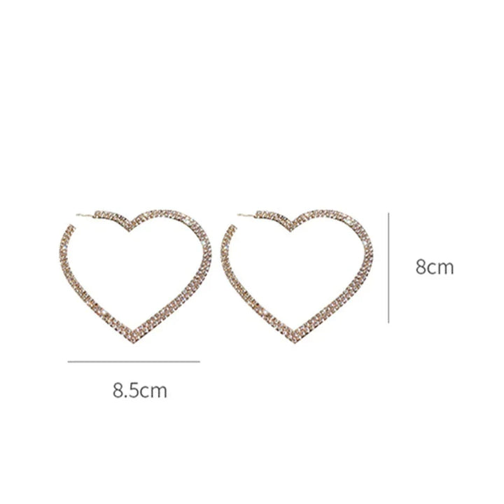 Close-up of large crystal heart earrings, showcasing brilliant sparkle & intricate design. Dazzling statement jewelry.