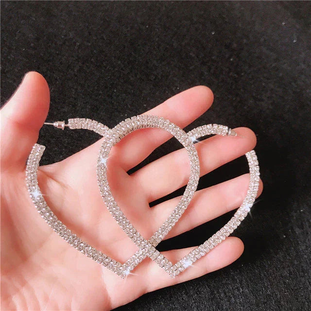 Luxurious large crystal heart earrings designed to sparkle. Perfect fashion accessory & statement jewelry for women.