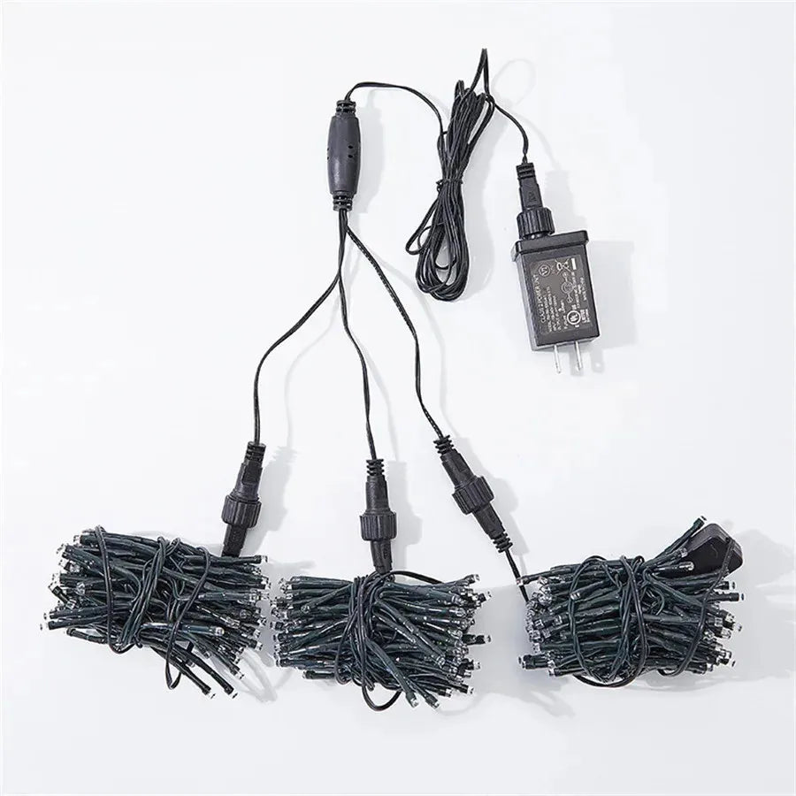 Dynamic LED meteor shower lights with chasing effect, enhancing garden trees for festive outdoor ambiance.