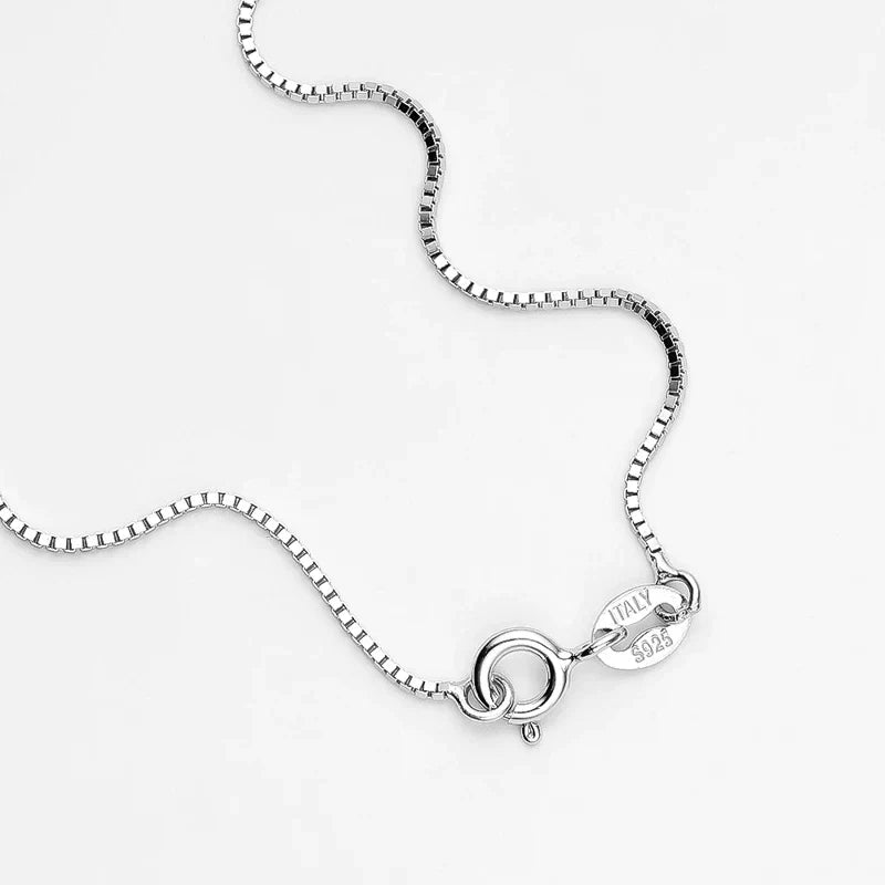 Fine jewelry women's moissanite necklace in sterling silver, featuring a dazzling and sparkling gem.