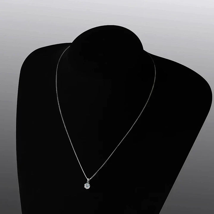Elegant women's gift: a dazzling moissanite necklace, sterling silver, perfect for sparkle and style.