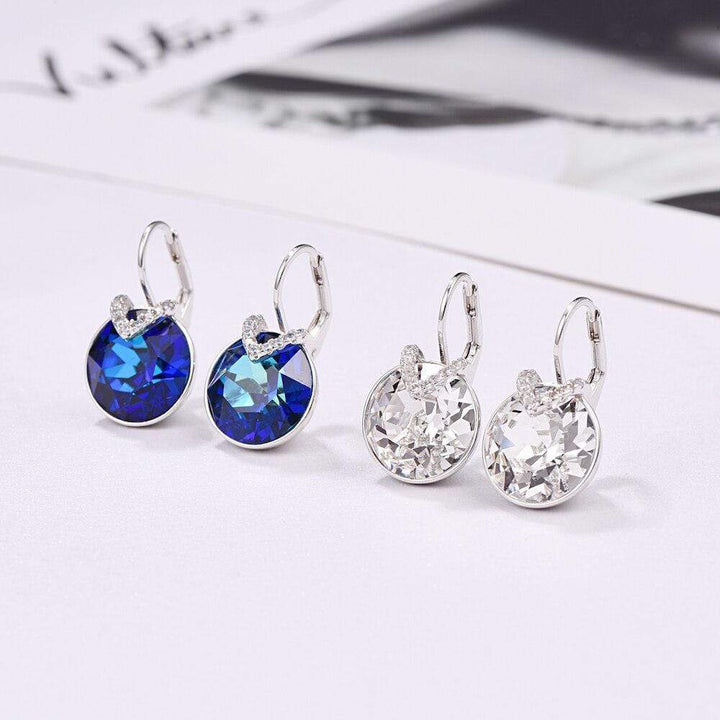 Elegant silver dangle earrings with dazzling sparkle, ideal party or special occasion accessory.