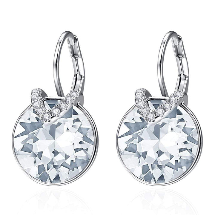Sparkling silver drop earrings, an elegant accessory for women's party and fashion jewelry.