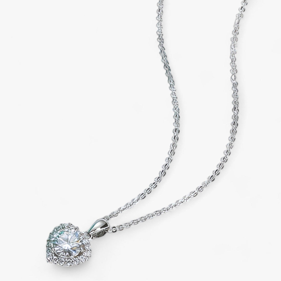 Romantic sterling silver heart pendant necklace with a dazzling moissanite, an exquisite women's jewelry piece.