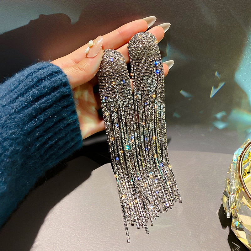 Dazzling women's rhinestone tassel drop earrings, perfect for elegant party or wedding wear. Statement jewelry.