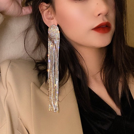 Long rhinestone tassel drop earrings in motion. Dazzling women's jewelry, elegant for any party or wedding event.