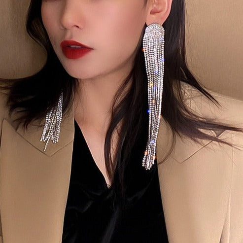Silver-tone women's rhinestone tassel drop earrings. Elegant statement jewelry, perfect for wedding or party glamour.