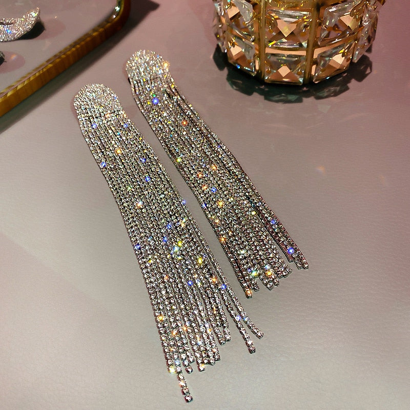 Dazzling women's rhinestone tassel drop earrings. Elegant statement jewelry for weddings, parties, or special events.