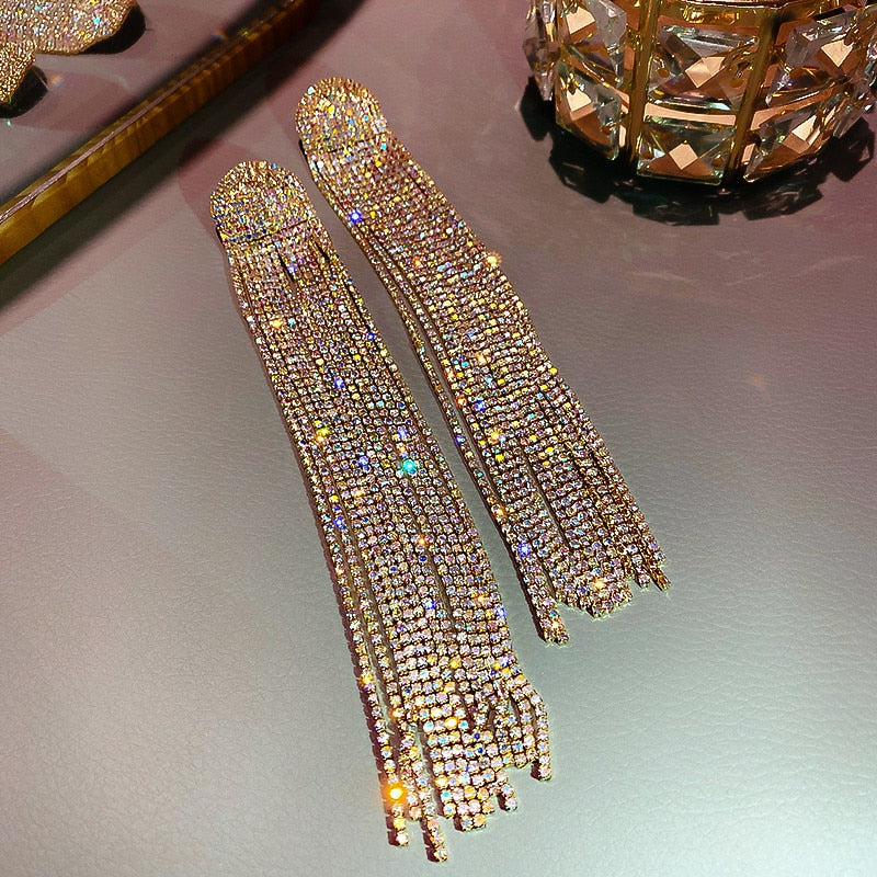 Stunning women's rhinestone tassel drop earrings. Elegant statement party & wedding jewelry for a glamorous touch.
