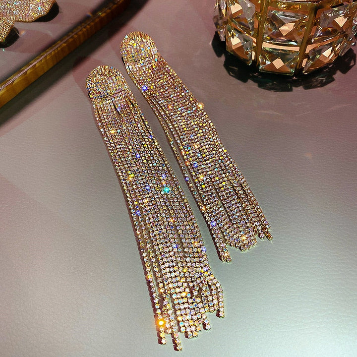 Stunning women's rhinestone tassel drop earrings. Elegant statement party & wedding jewelry for a glamorous touch.