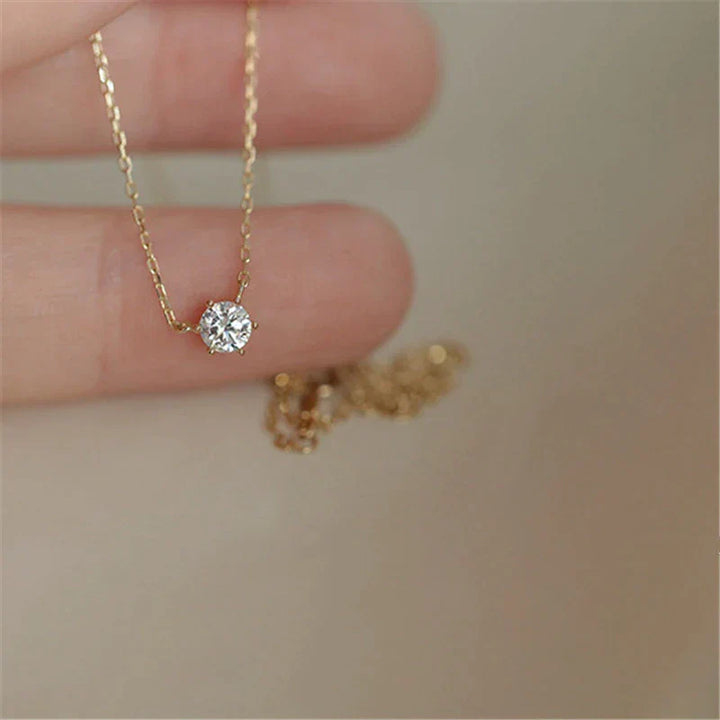Close-up of a dazzling gold plated zircon sparkle necklace, a beautiful women's collarbone statement piece.