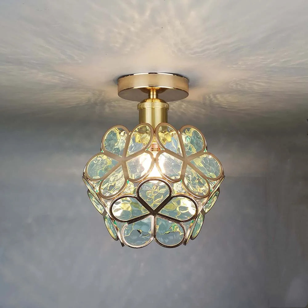 Decorative glass ceiling lamp with elegant floral pattern, perfect for modern home decor.